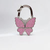 Silver foldable butterfly shaped handbag hook with pink glitter finish