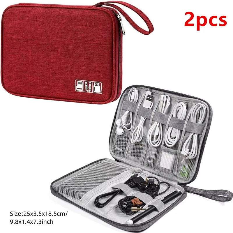 A red portable digital organizer storage pouch with multiple compartments and accessories.