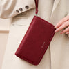 A maroon slim RFID-blocking PU leather wallet with a leather strap is shown being held against a beige blazer.