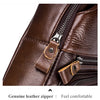 Close-up of a brown genuine leather zipper on a men's crossbody messenger bag