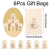 A set of six beige drawstring gift bags featuring embroidered Easter bunny designs.