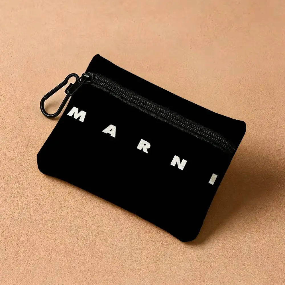 Black zippered pouch with the brand name MARNI printed on it, shown against a light background.