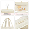 Sac organisateur de maquillage portable beige avec porte-crochets pivotant et deux poches transparentes zippées.