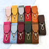 A collection of canvas cotton bag straps in various colors, including pink, yellow, gray, red, orange, and brown.