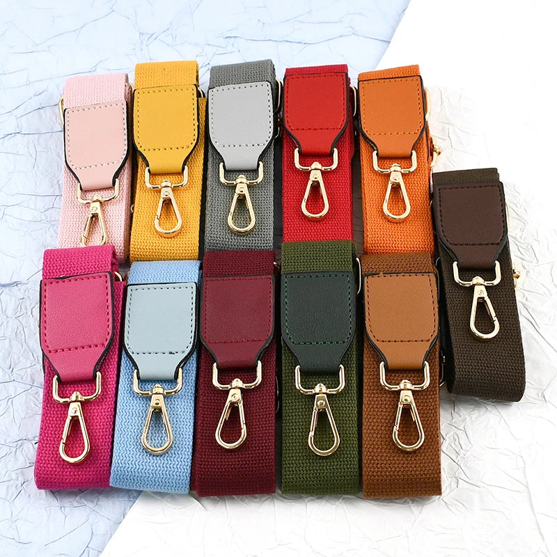A collection of canvas cotton bag straps in various colors, including pink, yellow, gray, red, orange, and brown.
