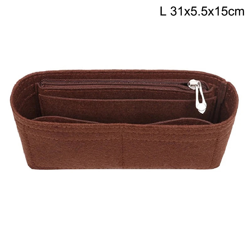 A brown felt bag insert organizer with a zippered compartment and a pull tab.