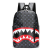 Black plaid laptop backpack featuring a red and white tooth pattern design.