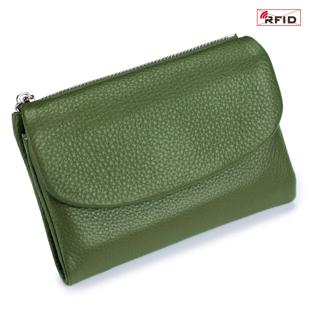 A olive green genuine leather mini card holder wallet with a zippered closure.