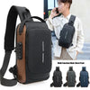 A black multi-function male chest pack bag with brown accents shown next to a man.