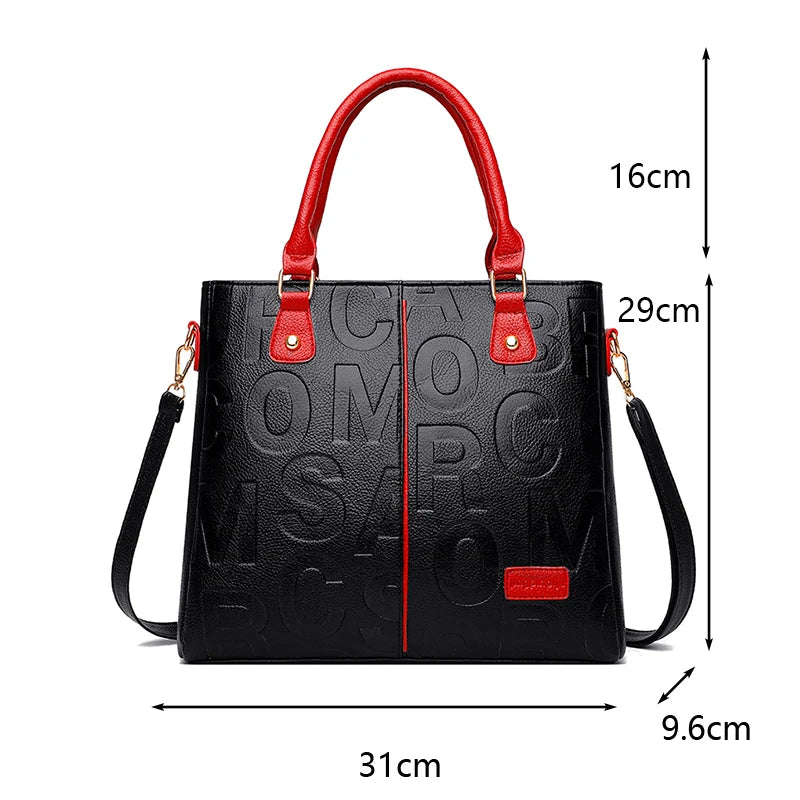 Sac bandoulière en cuir PU noir avec accents rouges et quincaillerie dorée, vue de face.