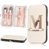 A beige cosmetic pouch containing a stainless steel nail clipper set and a large matching cosmetic case.