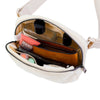 Ivory fleece crossbody belt bag with a clear pouch and a brown leather wallet inside