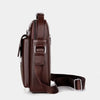 A dark brown vintage PU leather crossbody messenger bag with a zipper and strap.