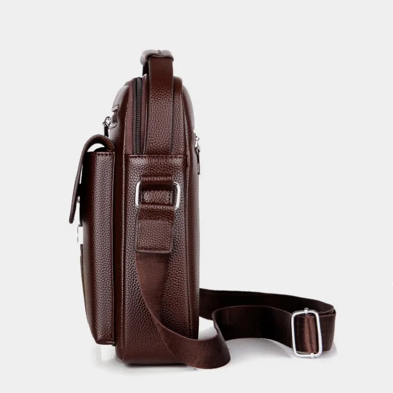 A dark brown vintage PU leather crossbody messenger bag with a zipper and strap.