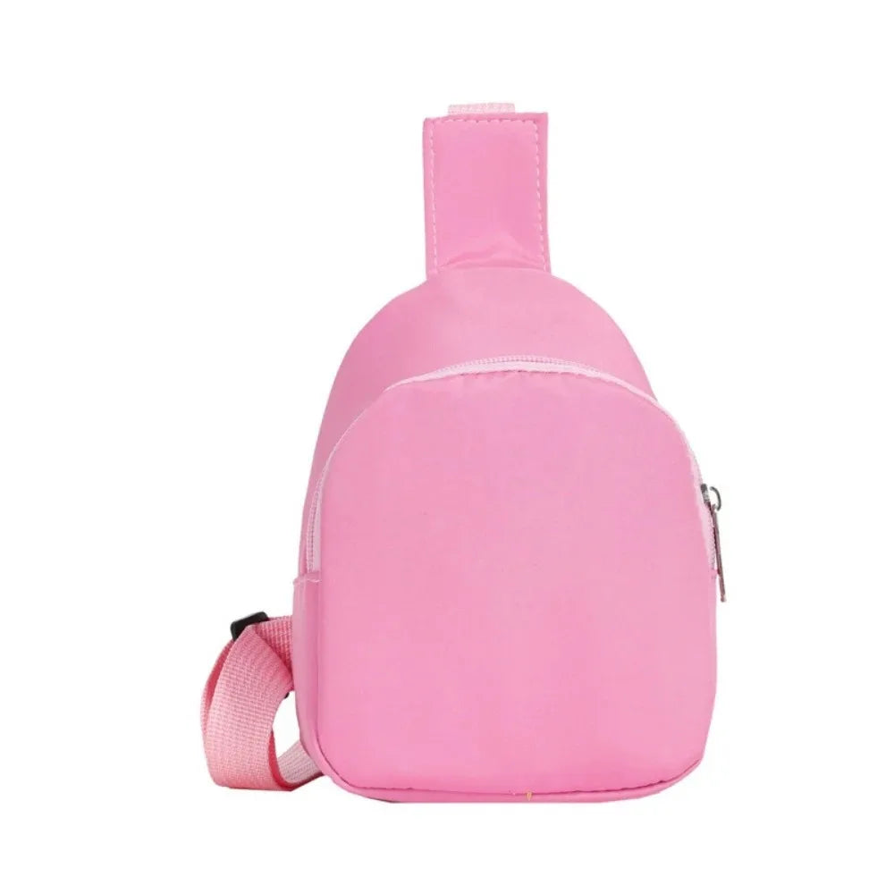 A pink nylon crossbody bag for kids with a zipper and pink strap.