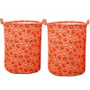 Deux paniers à linge en tissu orange avec un motif de fraise.
