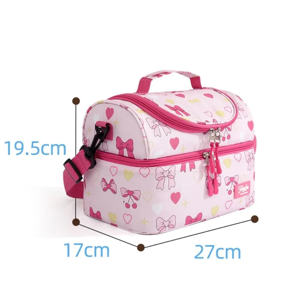 Pink insulated double-layer lunch bag for kids with cute cartoon prints shown from above.