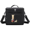 Black insulated canvas lunch bag with dual handles and a gold letter T design