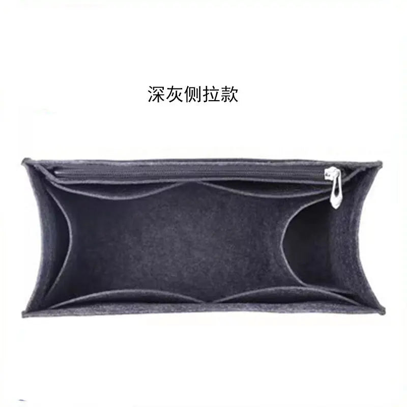 A dark gray felt bag organizer insert with a zipper closure.