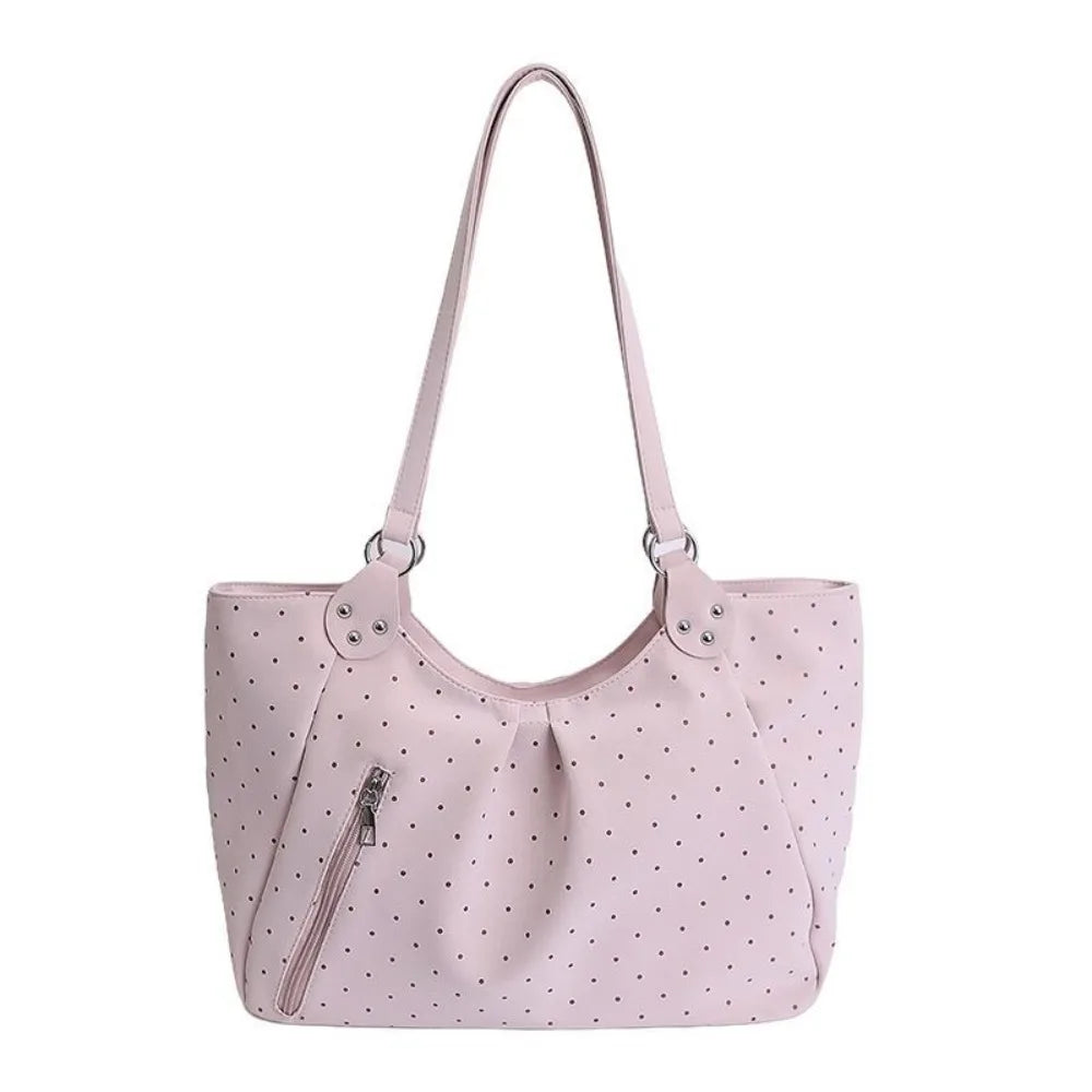 A light pink retro polka dot shoulder tote bag with a drawstring closure.