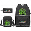 A black backpack featuring a Minecraft themed graphic and an accompanying black pouch.