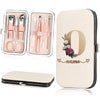 A beige cosmetic case holds a stainless steel nail clipper set with scissors and other tools.