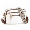 A white and brown patterned PU leather crossbody bag with gold hardware.