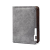 A grey leather wallet with a brown stitched edge and a silver card slot.