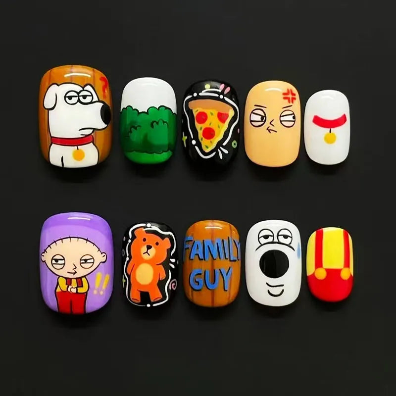 A set of ten cute cartoon press-on nails featuring various characters and designs on a black background.