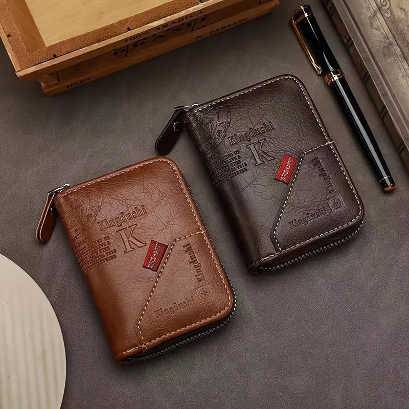A brown leather slim wallet and a black pen are displayed on a gray surface.