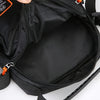 Black men's crossbody sling bag open showing the interior and zipper details