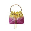 A yellow and pink textured evening clutch with a gold chain strap.