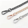 Three metal chains in black, gold, and silver with lobster clasps displayed against a white background.