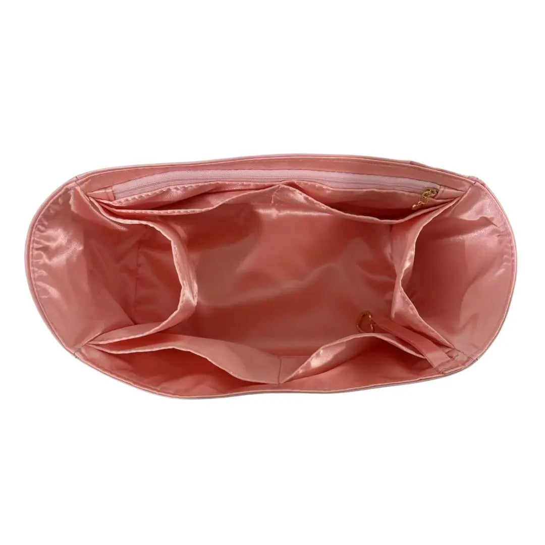A pink luxury bag organizer insert featuring a silk lining and a folded design.