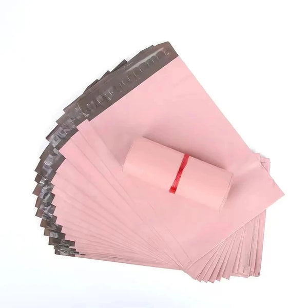 Pink self-adhesive storage bags stacked and fanned out for shipping and packing