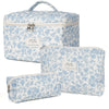 A set of light blue floral patterned quilted cotton makeup organizers.