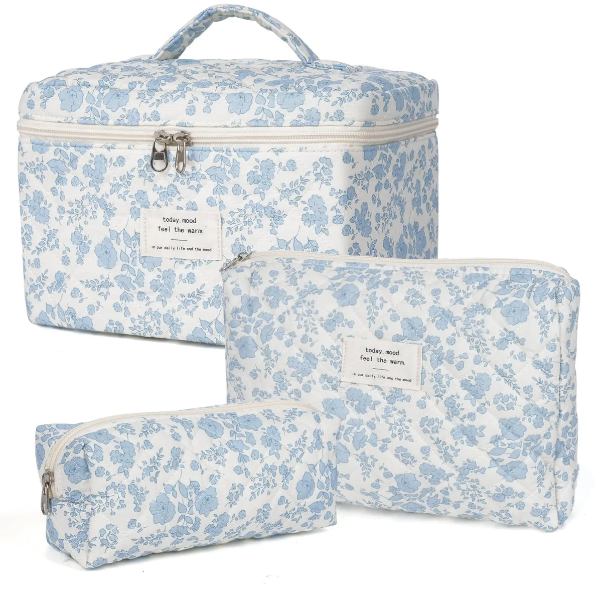 A set of light blue floral patterned quilted cotton makeup organizers.
