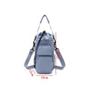 A light gray insulated water bottle crossbody bag with a separate phone pocket shown from the front.