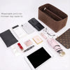 A collection of felt and leather accessories, including a bag organizer insert and various small items like pens, glasses, an