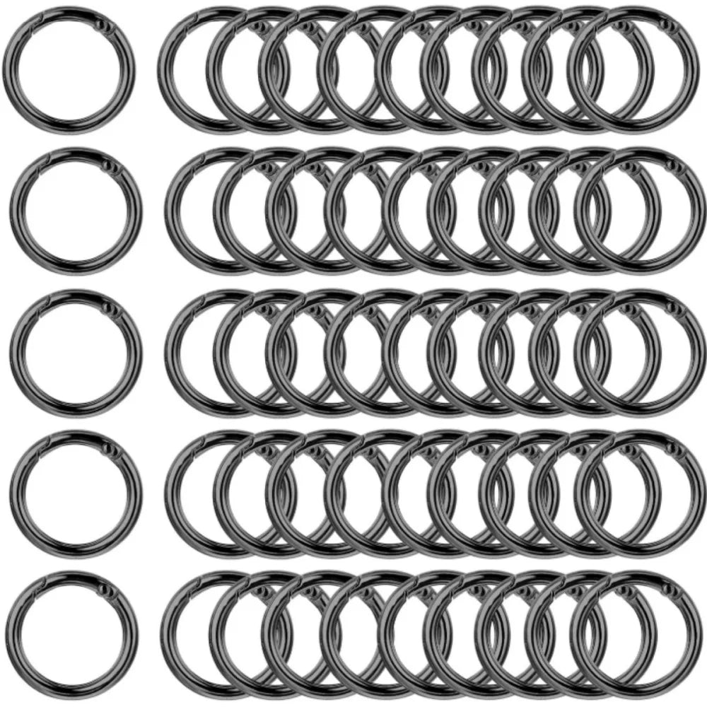 A collection of stainless steel spring clasp keychain rings and carabiner clips.