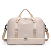 A light beige expandable nylon travel duffle bag with tan straps and zipper visible from the front.