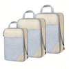 A set of three light beige and blue fabric storage organizers with handles.