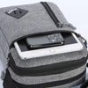 A gray lightweight crossbody sling bag with a black zipper and a smartphone visible inside.
