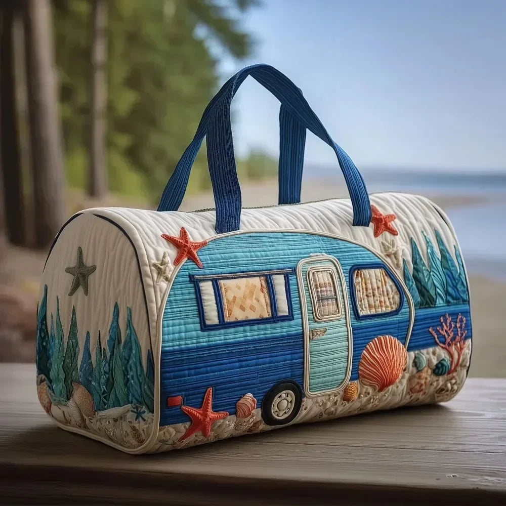 A quilted blue and white travel duffle bag shaped like a vintage van with starfish decorations.