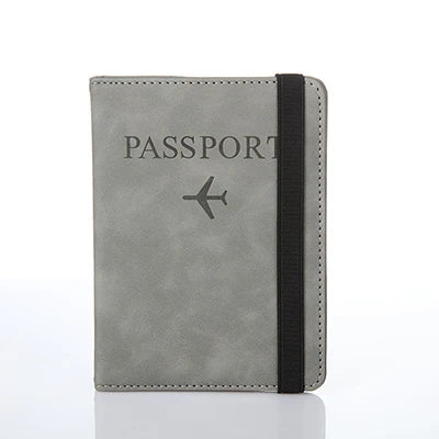 A gray passport organizer with a black strap and a stylized airplane icon on the cover.