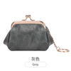 A grey leather coin purse with a gold-toned clasp and chain attached to the top.