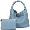 A light blue handwoven faux leather tote bag and matching clutch displayed together.