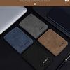 A display of various colored leather wallet and card cases shown in a physical shooting setup.