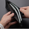 A hand is opening a black PU leather folding wallet to show the contents.