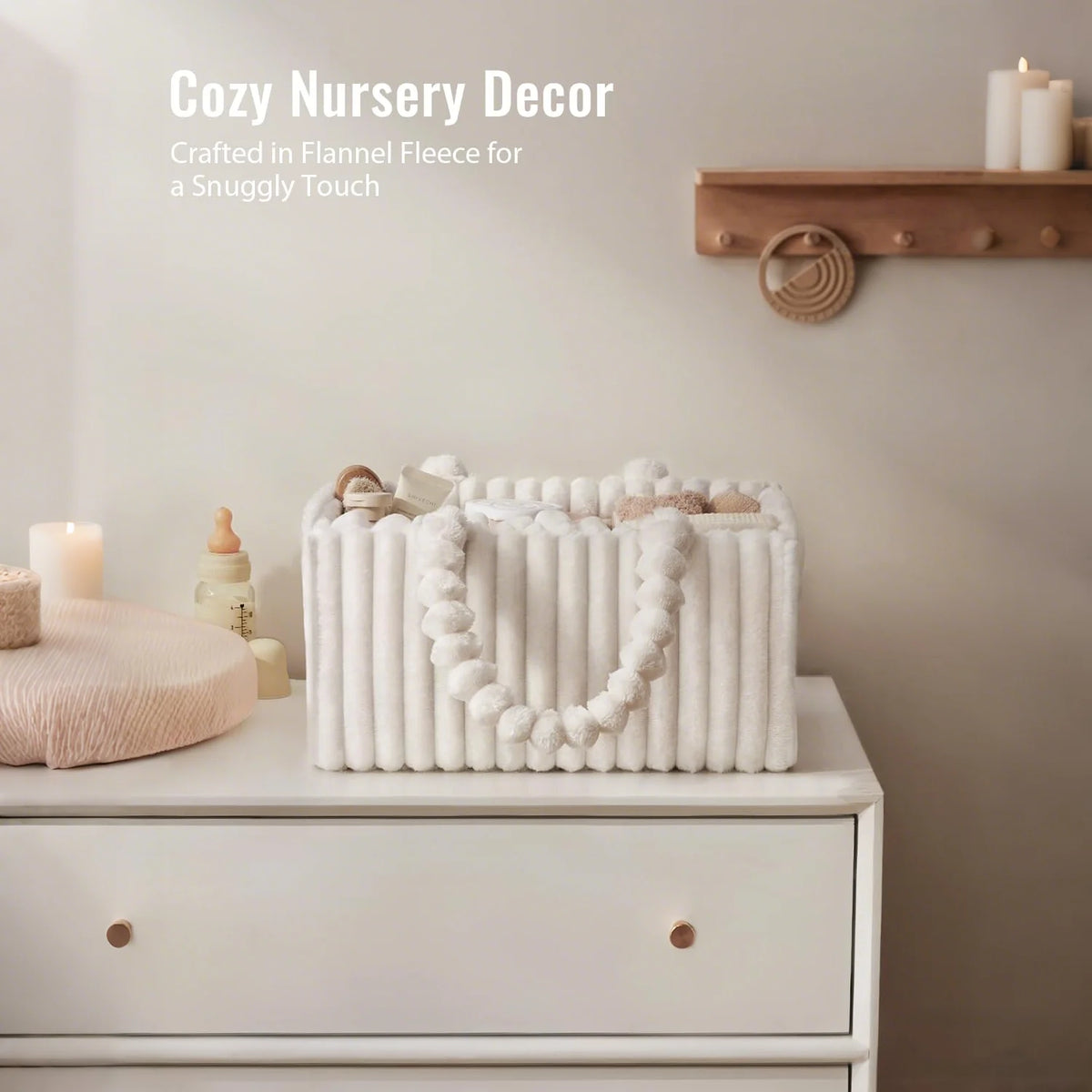 A white flannel diaper caddy organizer filled with soft fabric items displayed on a light-colored dresser.